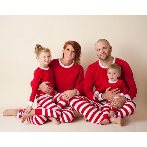 family wearing red and white pajamas