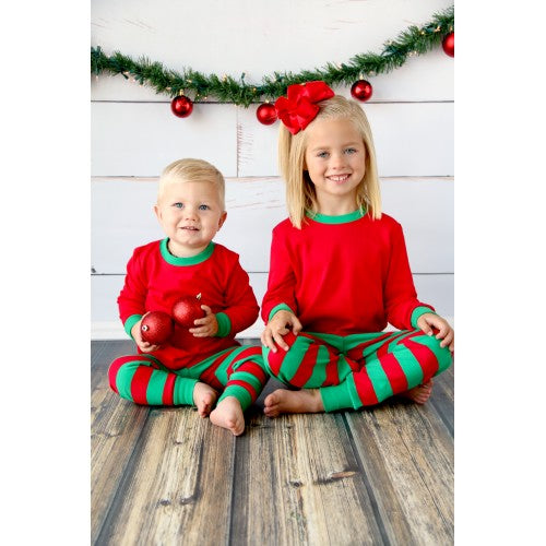 children wearing christmas pajamas
