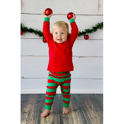 little boy in red and green pajamas